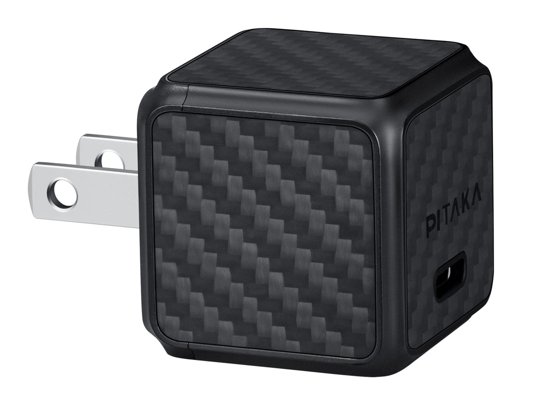 Compact GaN charger with carbon fiber.