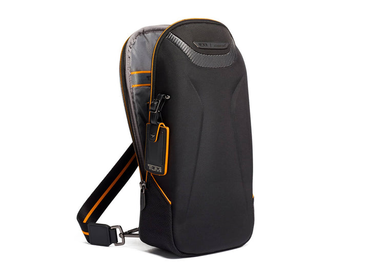 TUMI | McLaren Torque Sling, side open#color_black-with-papaya