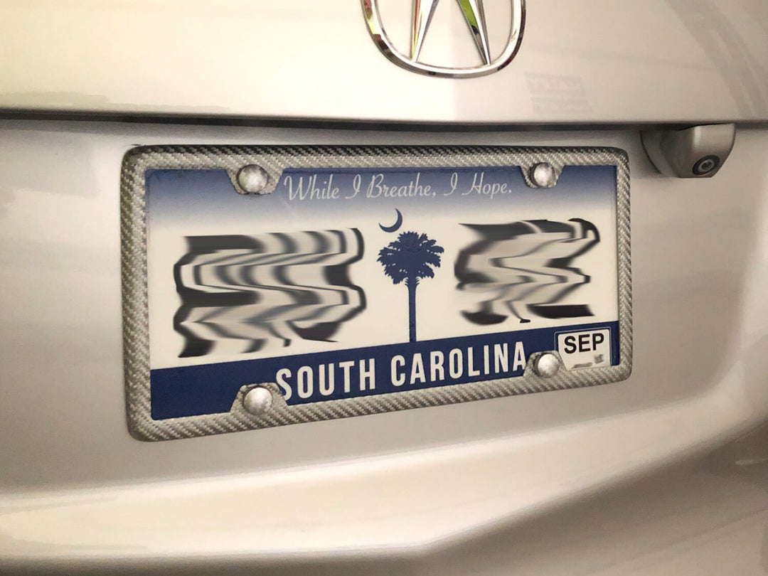 Silver fiberglass license plate frame installed on a vehicle (Acura MDX)with a South Carolina license plate